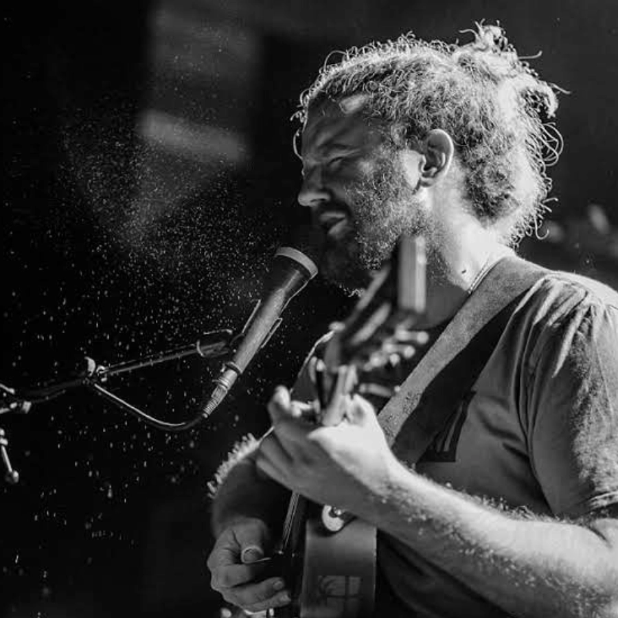 James Dixon singing and playing guitar