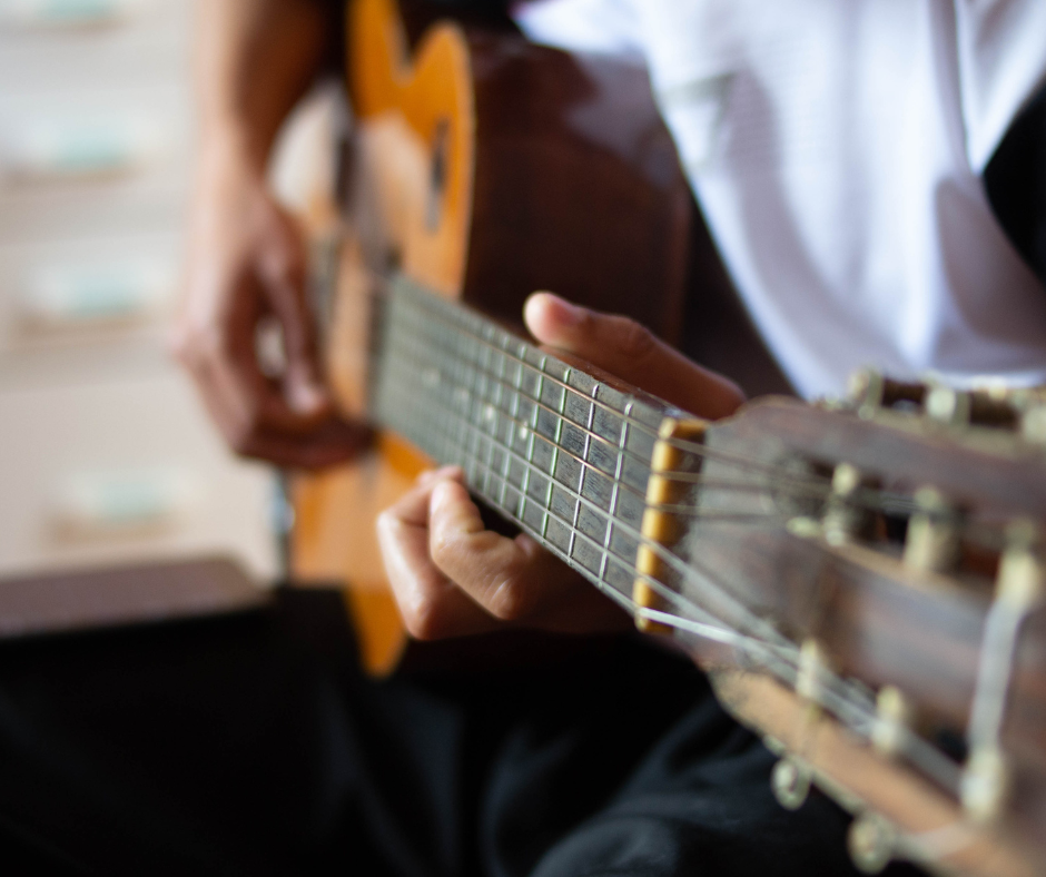 Man playing an acoustic guitar